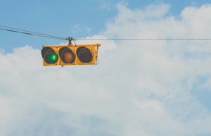 a green traffic light representing deciding to sell a commercial property